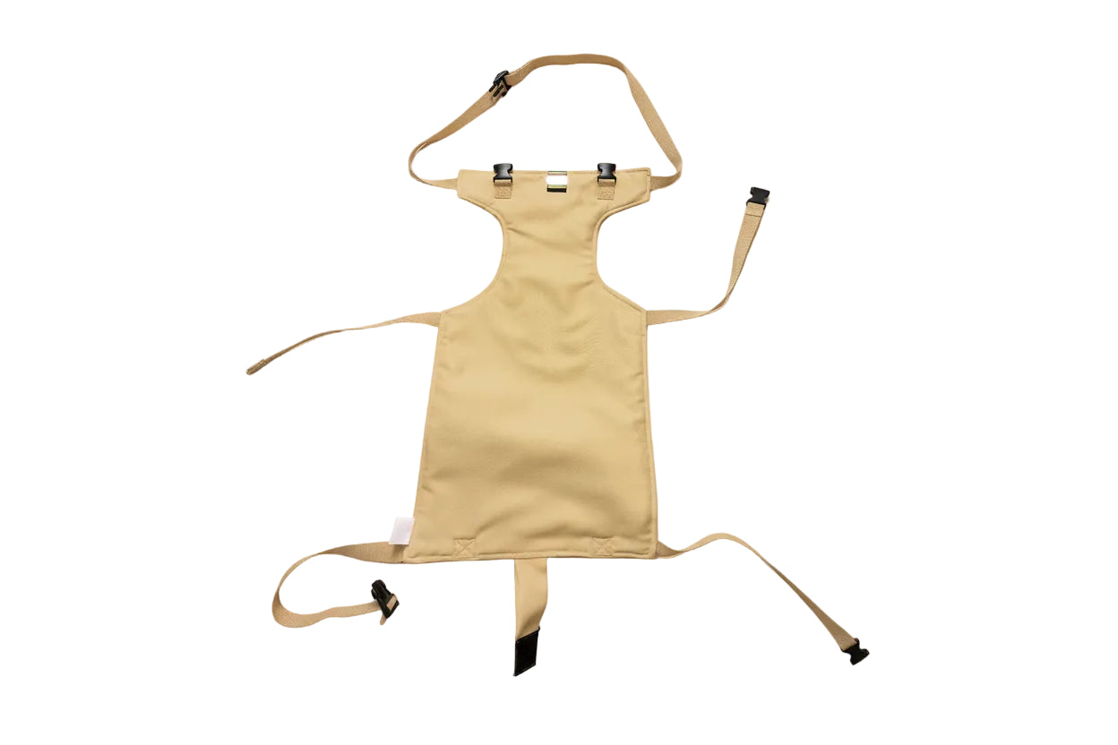 A clean, premium product photograph of a beige baby chair safety harness.
The harness is fully visible, laid flat and centered.
Soft off-white or warm beige background.
Minimal, modern, calm aesthetic.
Natural soft lighting with subtle shadows.
No text, no logos, no watermarks.
High-quality e-commerce photography style.
Focus on fabric texture and stitching